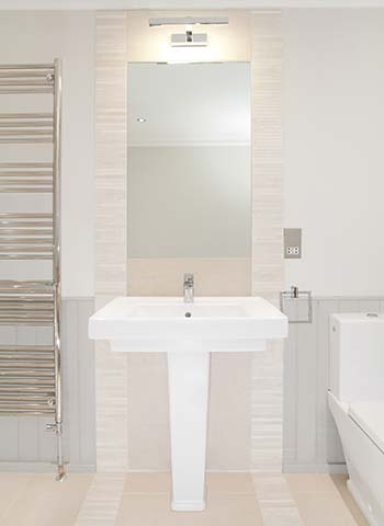 Property Interior - bathroom with basin, mirror and towel rail
